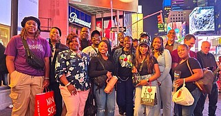Members of the Arkansas Martin Luther King Commission delegation pose for a photo in Times Square, New York City. (Pine Bluff Commercial/Eplunus Colvin)